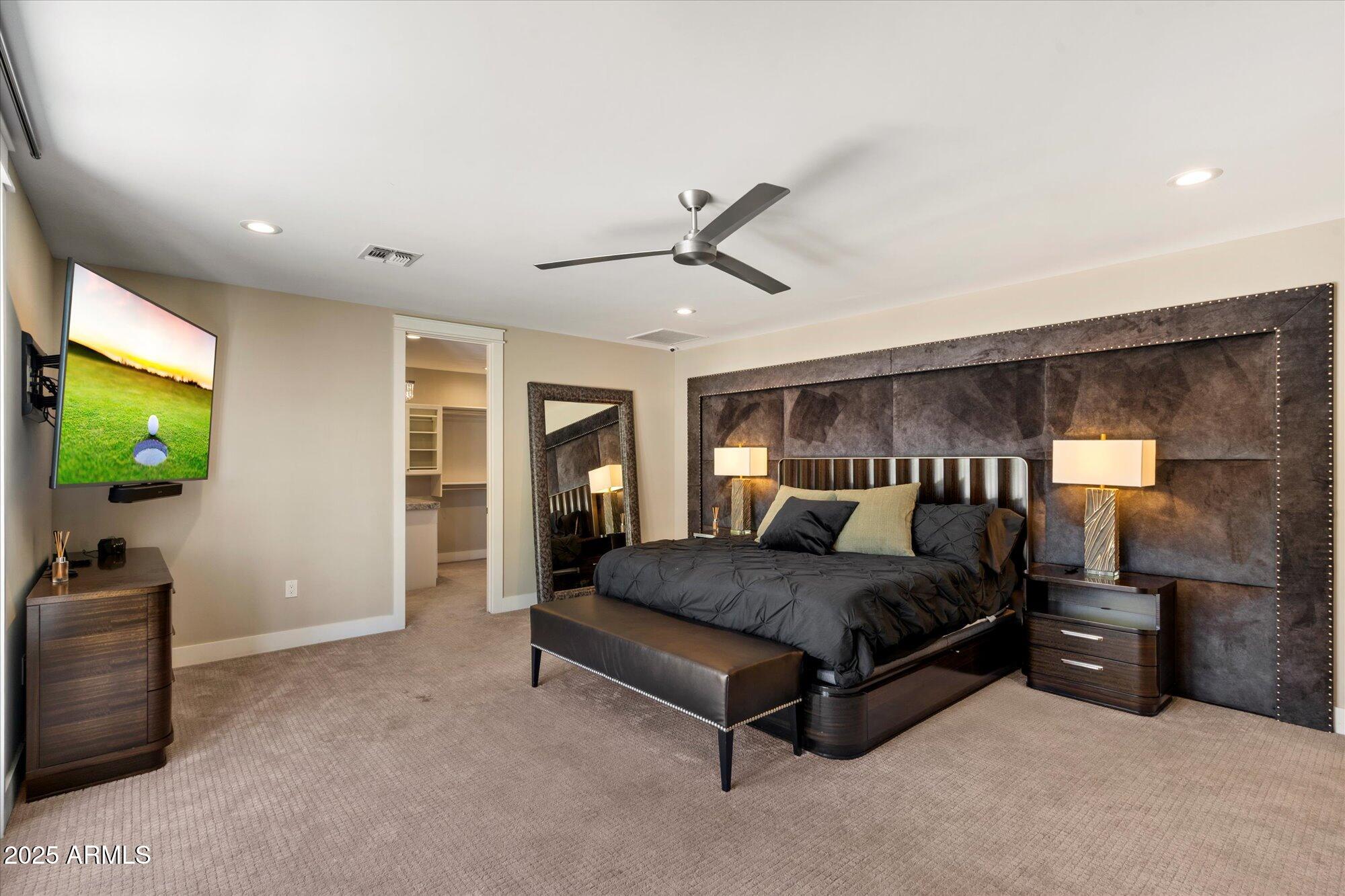 3810 East Devonshire Avenue Phoenix, AZ 85018 - Photo 12 of 34 a bedroom with a bed and a flat screen tv