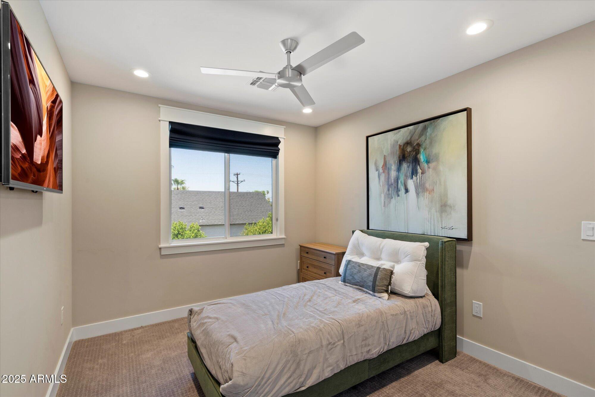 3810 East Devonshire Avenue Phoenix, AZ 85018 - Photo 17 of 34 a bedroom with a bed and a painting on the wall