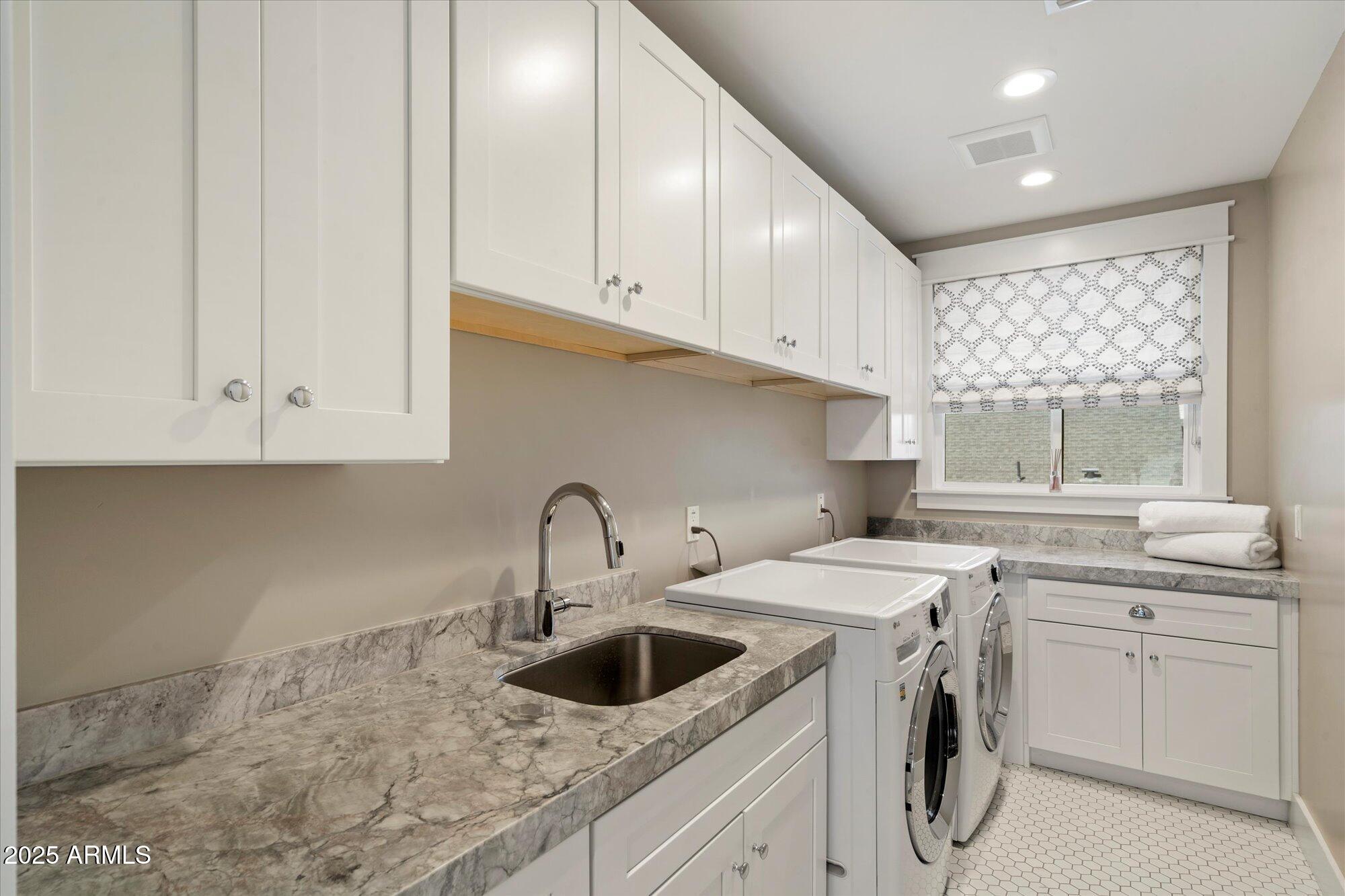3810 East Devonshire Avenue Phoenix, AZ 85018 - Photo 23 of 34 a kitchen with white cabinets sink and window
