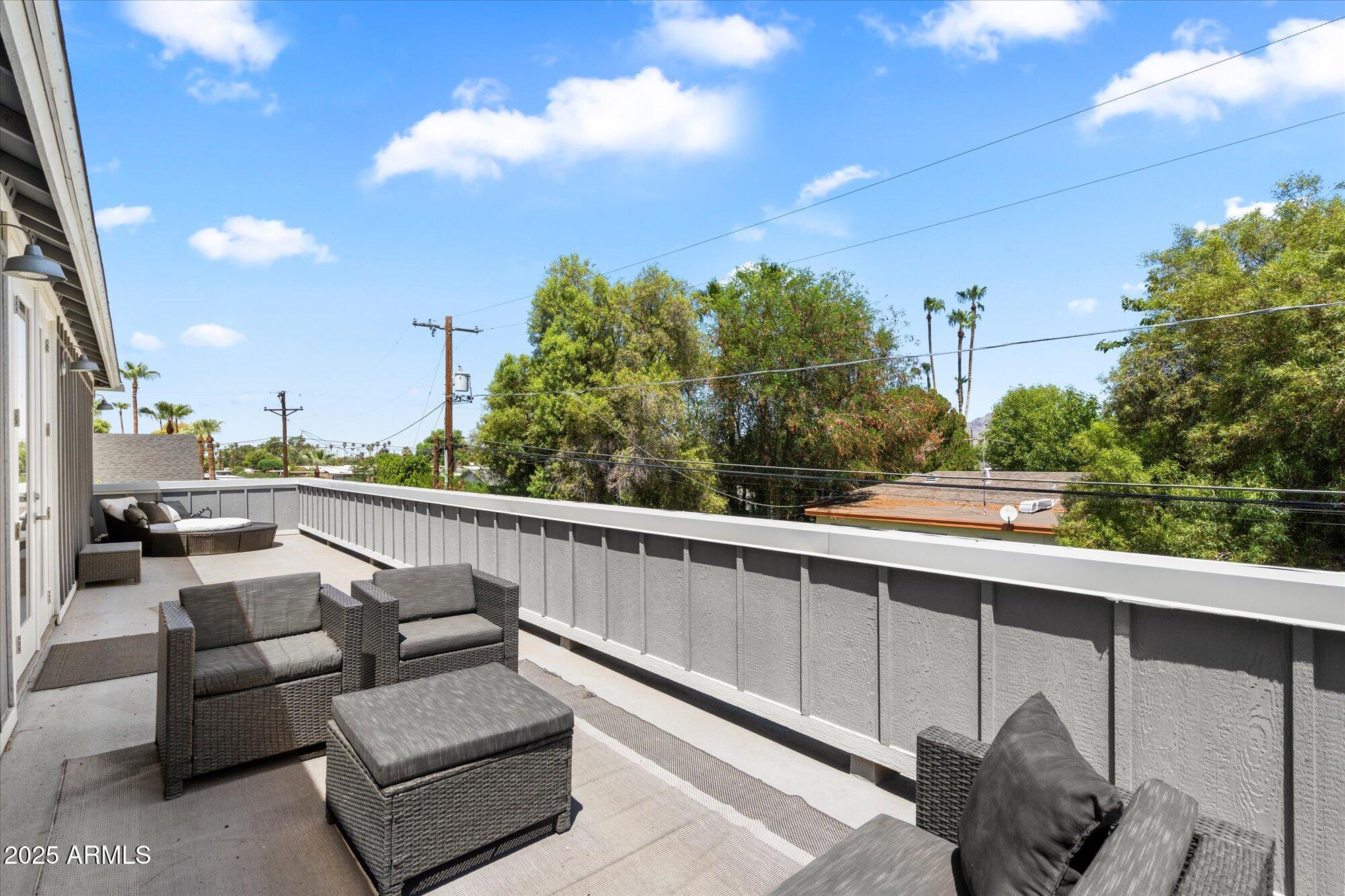 3810 East Devonshire Avenue Phoenix, AZ 85018 - Photo 27 of 34 a balcony with furniture and city view
