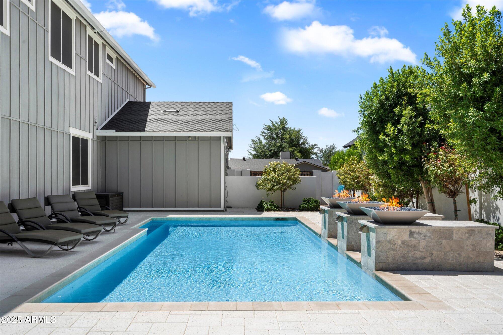 3810 East Devonshire Avenue Phoenix, AZ 85018 - Photo 28 of 34 a view of a chairs and table in the backyard