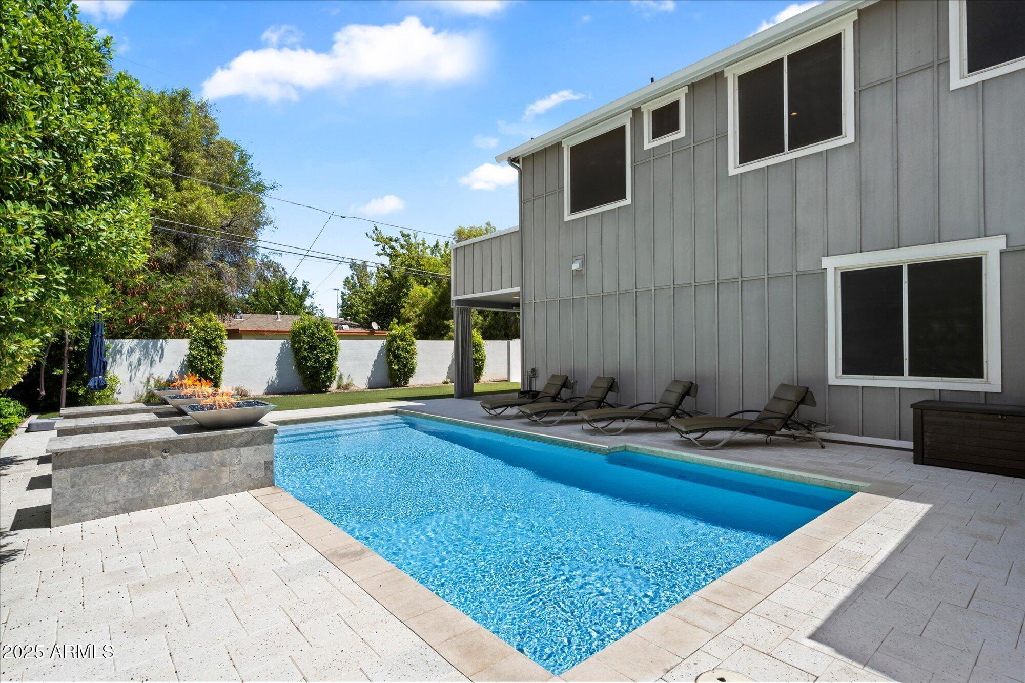 3810 East Devonshire Avenue Phoenix, AZ 85018 - Photo 29 of 34 a view of swimming pool with outdoor seating