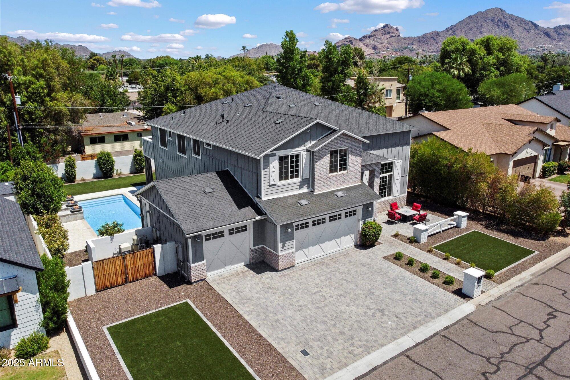 3810 East Devonshire Avenue Phoenix, AZ 85018 - Photo 32 of 34 an aerial view of a house with yard