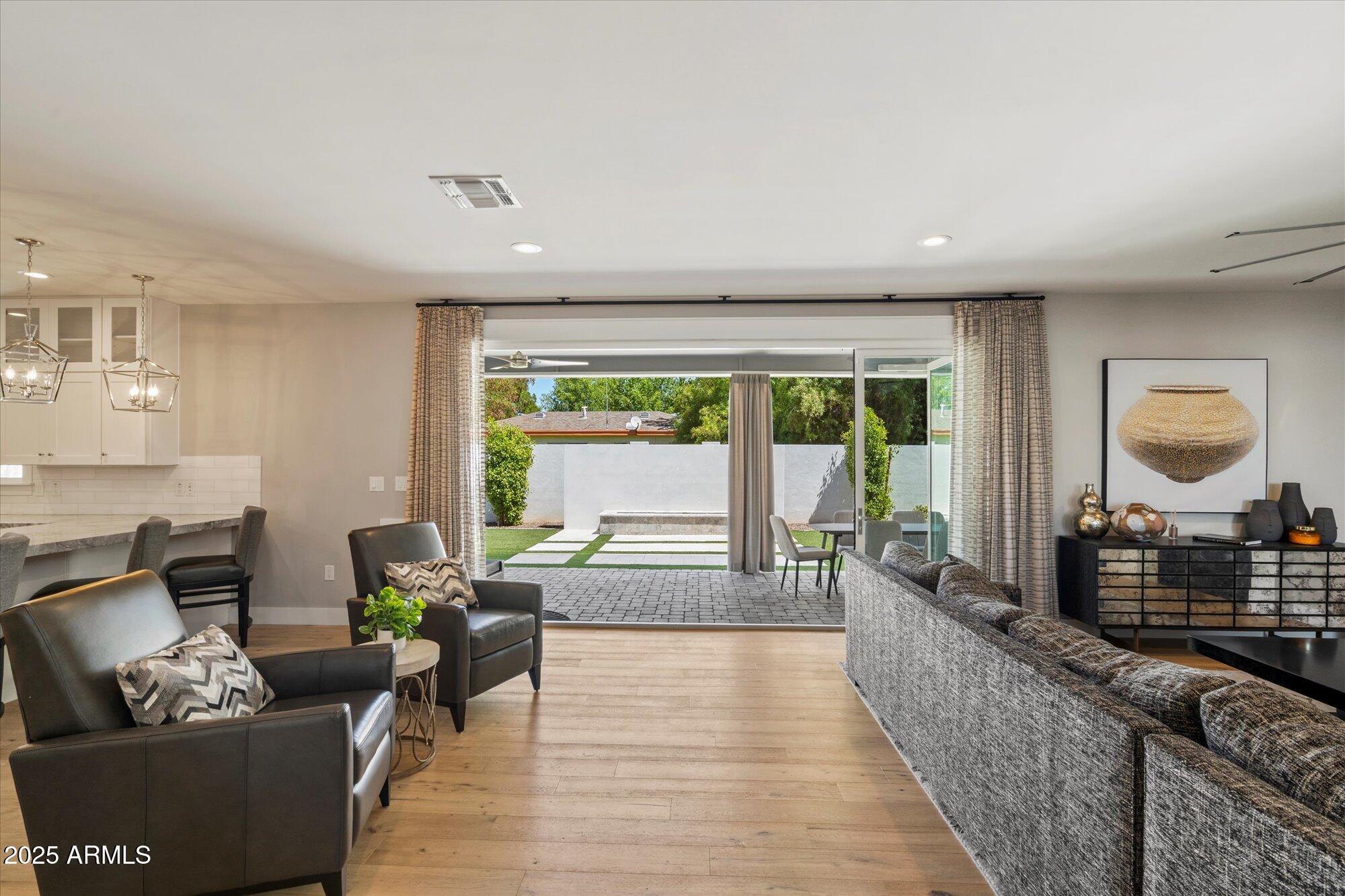 3810 East Devonshire Avenue Phoenix, AZ 85018 - Photo 5 of 34 a living room with furniture and a large window
