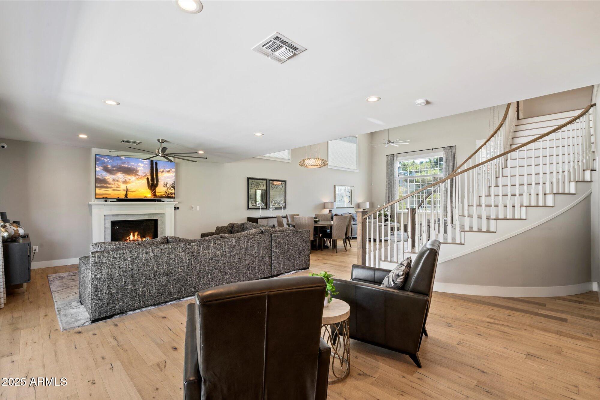 3810 East Devonshire Avenue Phoenix, AZ 85018 - Photo 7 of 34 a living room with furniture and a flat screen tv