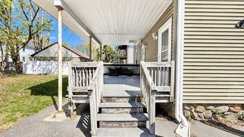86 Howard Street, Unit 1 Waltham, MA 02451 - Photo 17 of 22 a front view of a house with a garden