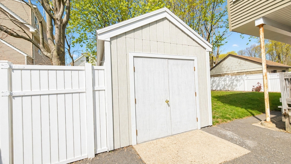 86 Howard Street, Unit 1 Waltham, MA 02451 - Photo 22 of 22 a view of a house with a backyard