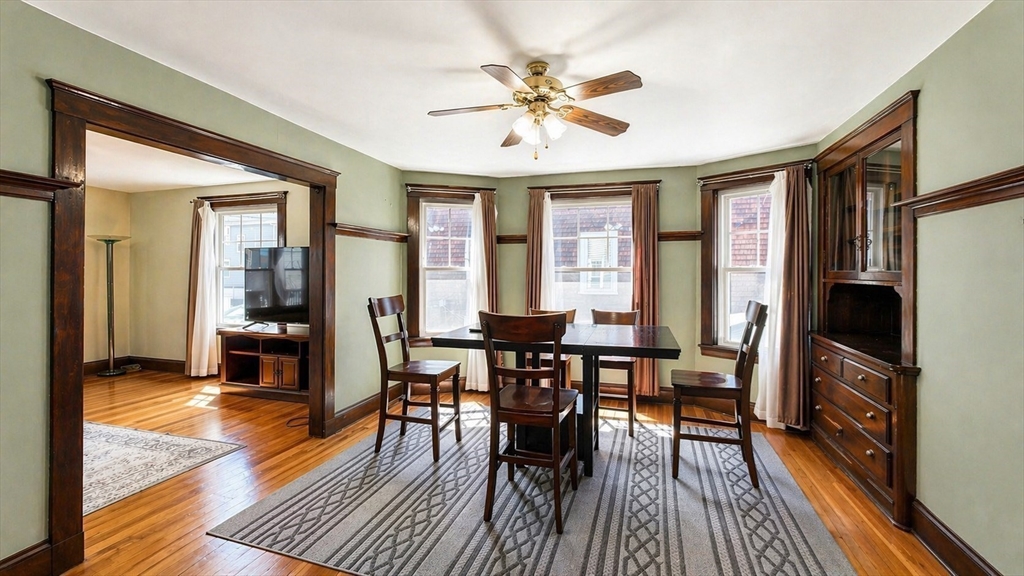 86 Howard Street, Unit 1 Waltham, MA 02451 - Photo 5 of 22 a view of a dining room with furniture window and wooden floor