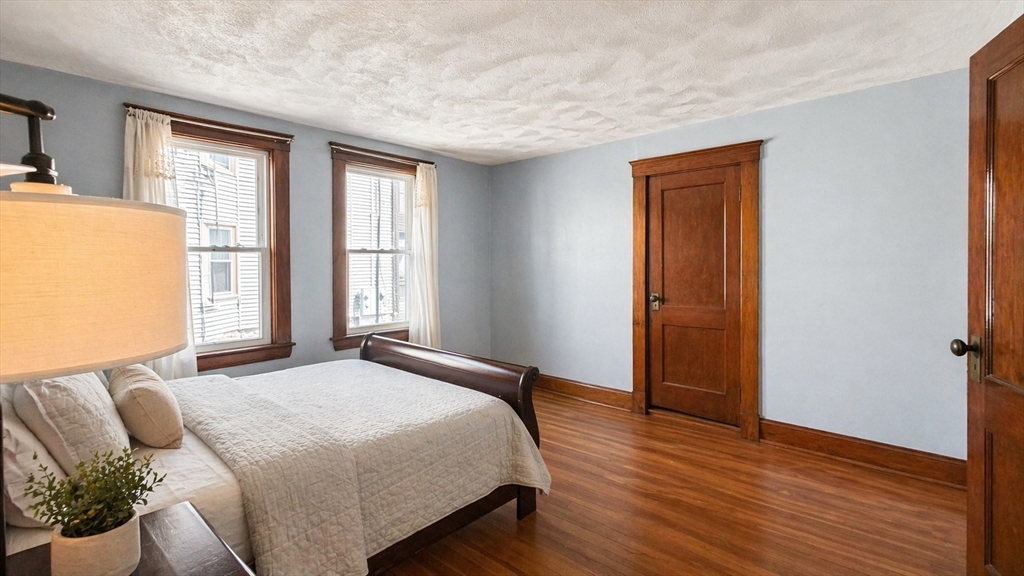 86 Howard Street, Unit 1 Waltham, MA 02451 - Photo 10 of 22 a bedroom with a bed and a window