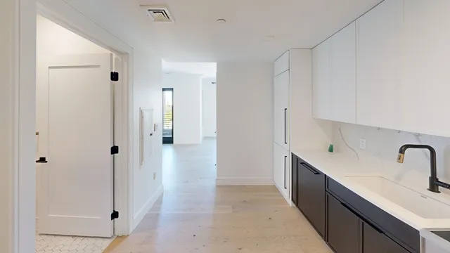 a bathroom with a sink and mirror