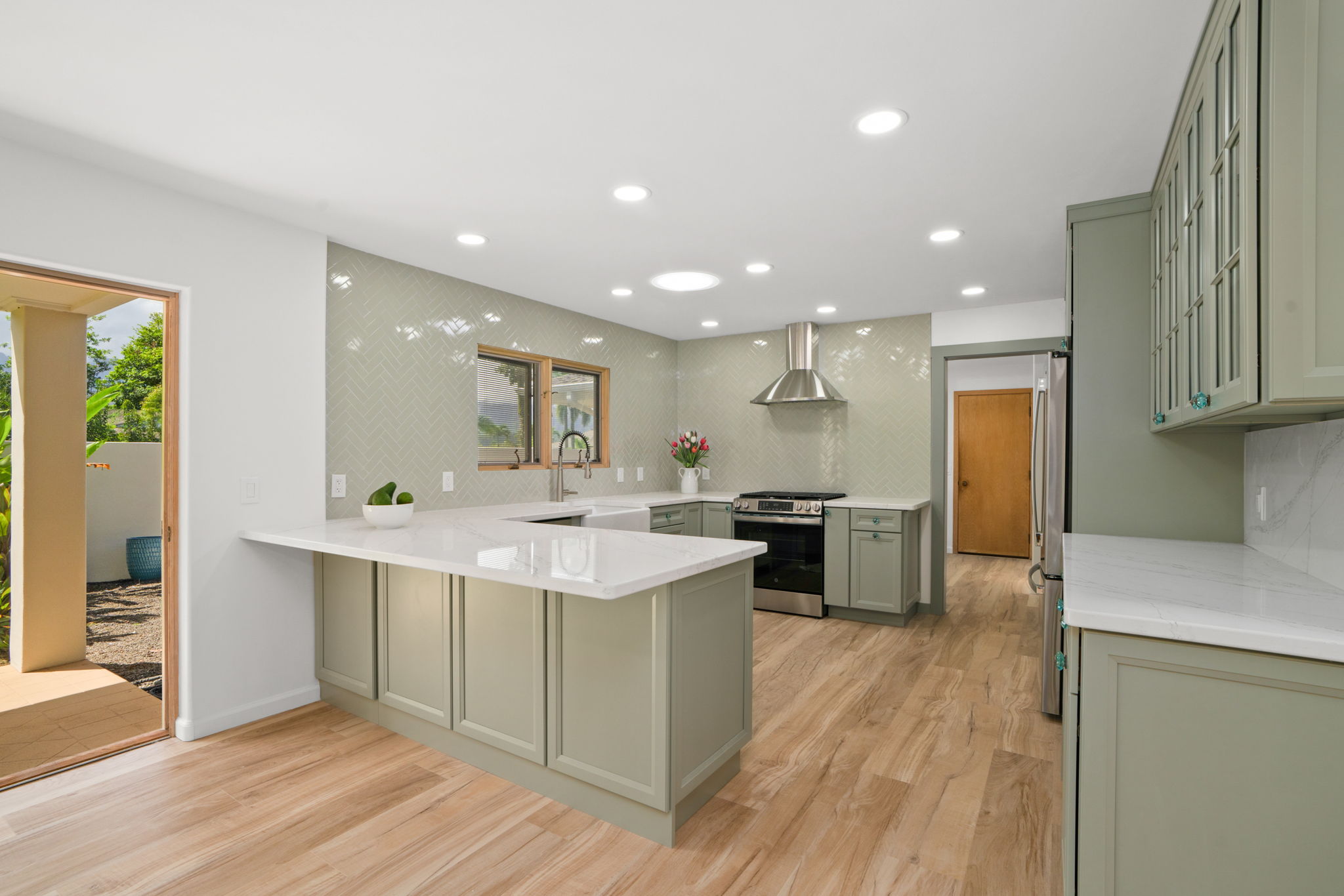 4179 Liholiho Road Princeville, HI 96722 - Photo 2 of 30 a kitchen with a sink and wooden floor