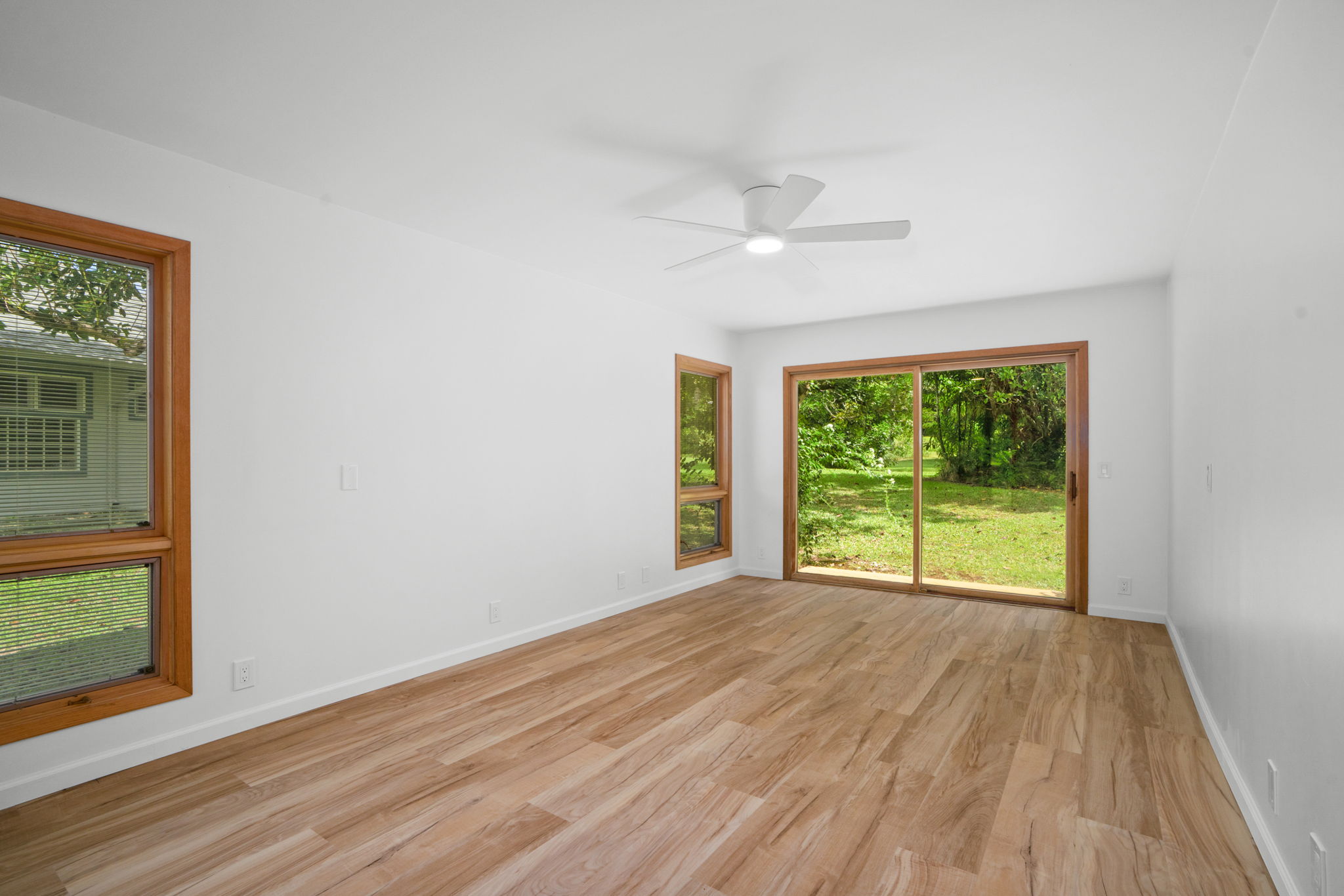 4179 Liholiho Road Princeville, HI 96722 - Photo 23 of 30 a view of an empty room with a window and wooden floor