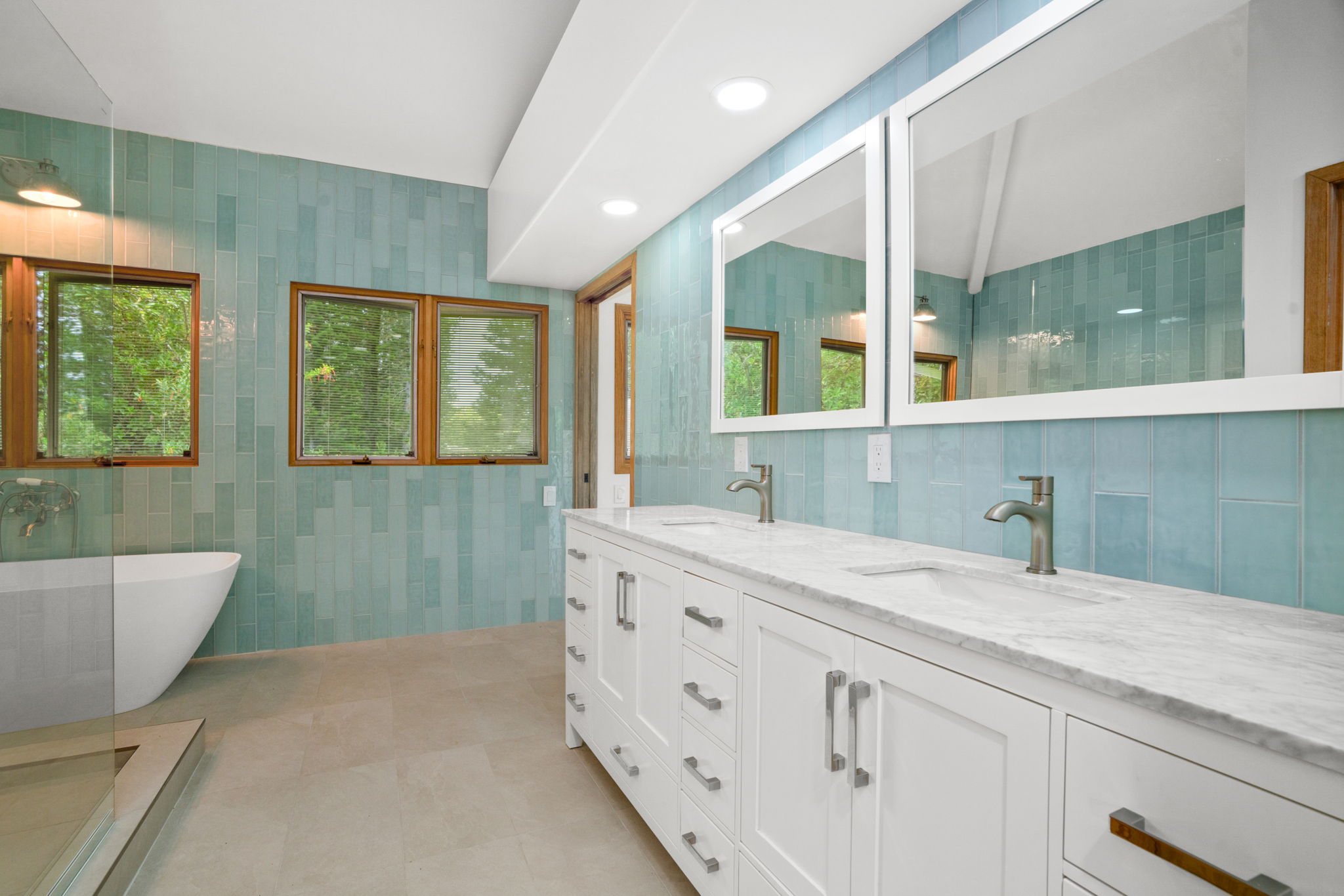 4179 Liholiho Road Princeville, HI 96722 - Photo 25 of 30 a spacious bathroom with a granite countertop sink mirror and a bathtub