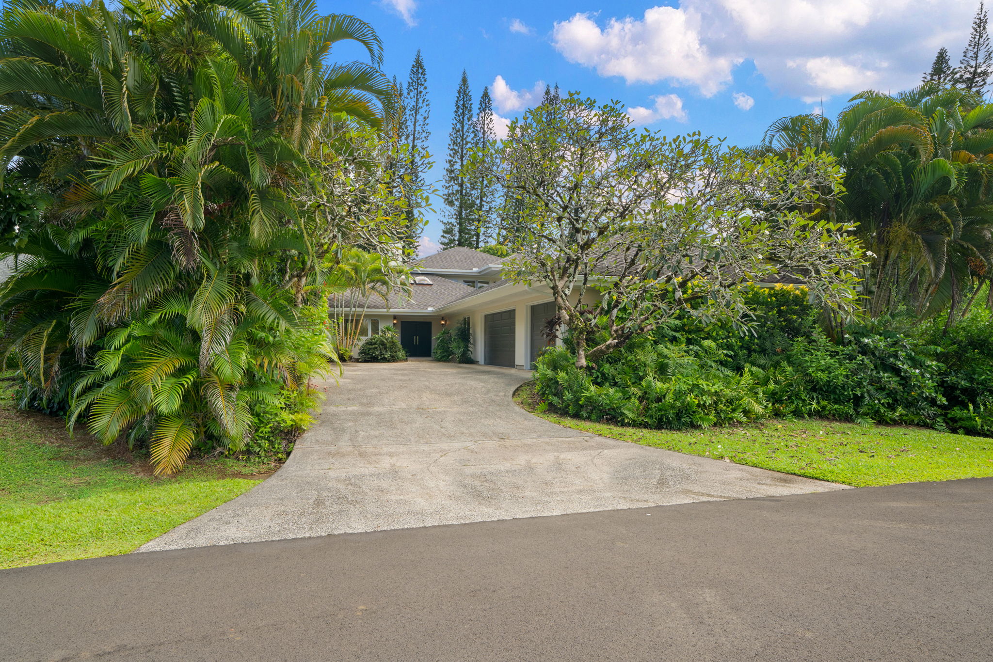 4179 Liholiho Road Princeville, HI 96722 - Photo 3 of 30 a view of a house with garden