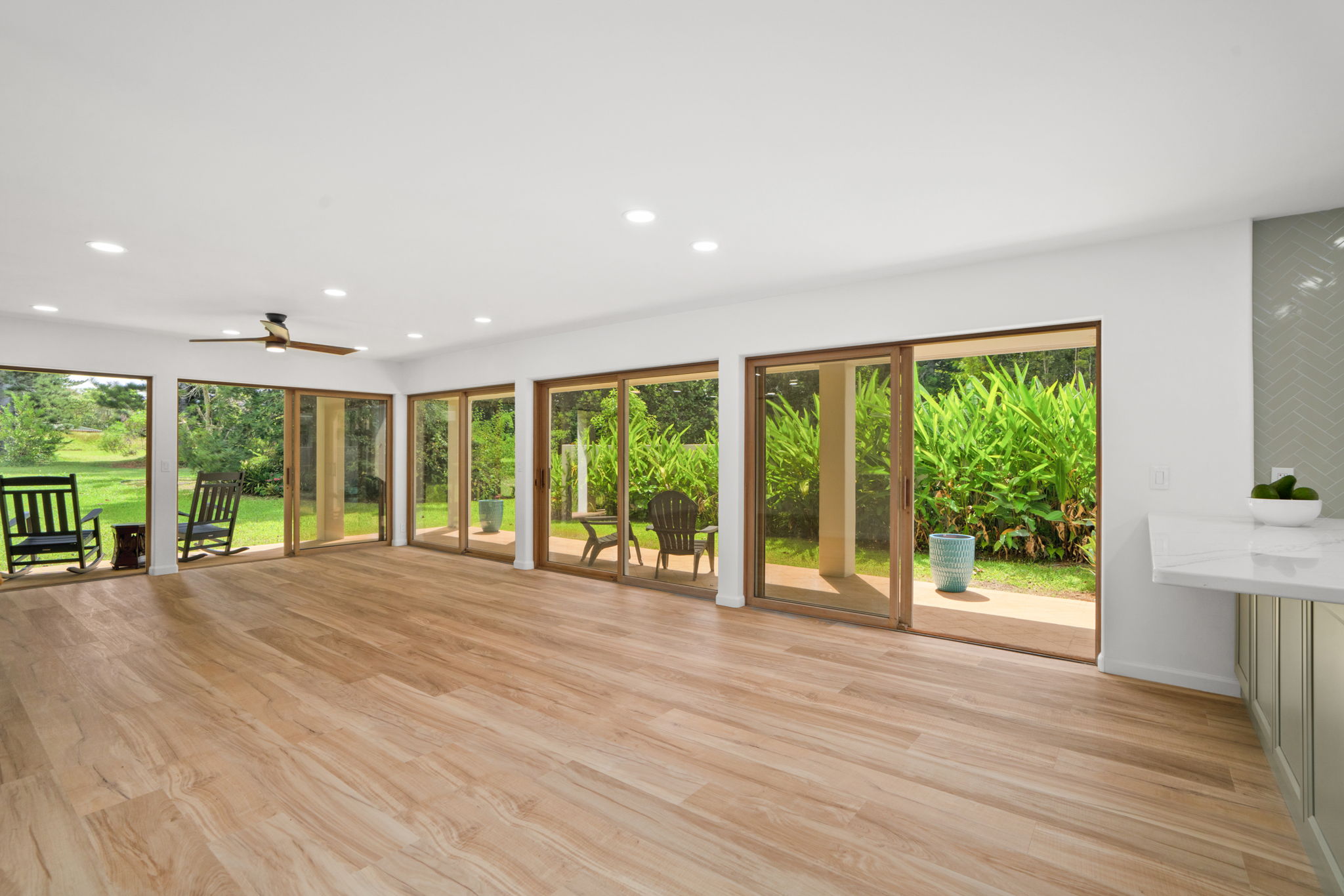 4179 Liholiho Road Princeville, HI 96722 - Photo 5 of 30 a view of an empty room with wooden floor and a window