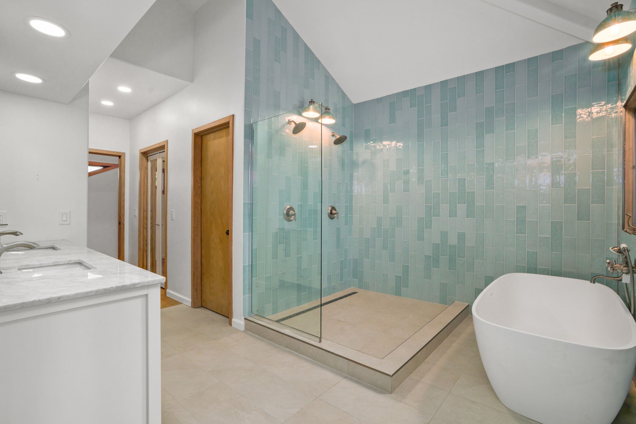 4179 Liholiho Road Princeville, HI 96722 - Photo 6 of 30 a en suite bathroom with a granite countertop sink a toilet a mirror and shower