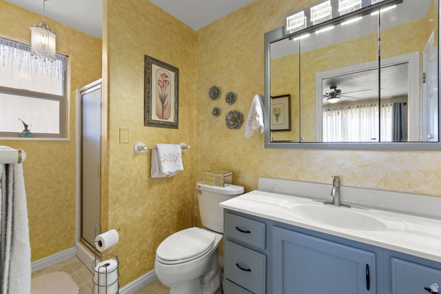 1225 North Dixie Downs Road, Unit 161 St. George, UT 84770 - Photo 11 of 21 Bathroom featuring a blue vanity with a white countertop, an oval undermount sink, and a chrome faucet