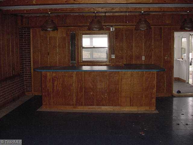 1335 Payne Road King, NC 27021 - Photo 14 of 16 Other. Previous garage-bar-going into sunroom