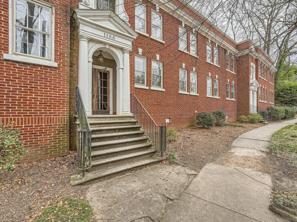 1166 Virginia Avenue Northeast, Unit 5 Atlanta, GA 30306 - Photo 1 of 1 a view of a building with a bench