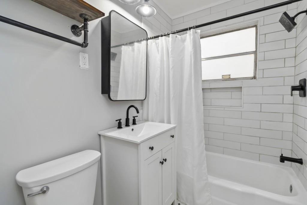 816 Piedmont Avenue Northeast, Unit 1 Atlanta, GA 30308 - Photo 12 of 21 a bathroom with a sink a toilet and shower