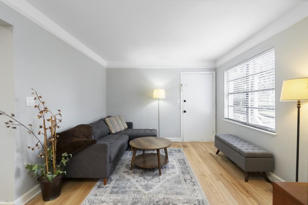 816 Piedmont Avenue Northeast, Unit 1 Atlanta, GA 30308 - Photo 2 of 21 a living room with furniture and a window