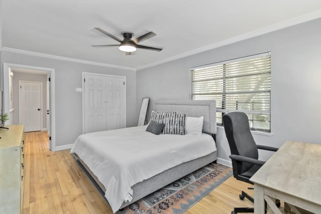816 Piedmont Avenue Northeast, Unit 1 Atlanta, GA 30308 - Photo 4 of 21 a bedroom with a large bed and a chair