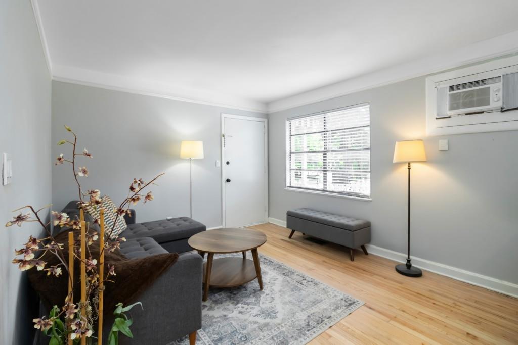 816 Piedmont Avenue Northeast, Unit 1 Atlanta, GA 30308 - Photo 7 of 21 a living room with furniture and a window