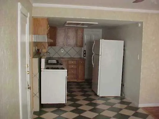 a utility room with cabinets washer and dryer