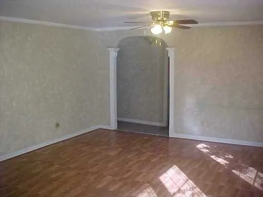 a view of a chandelier fan and closet in a room