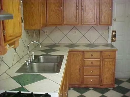 a kitchen with a sink and cabinets