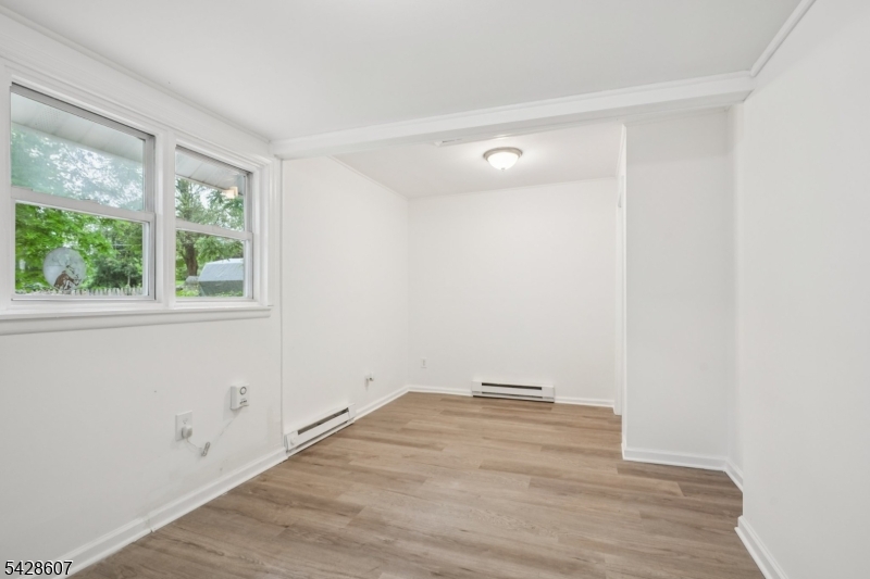 223 Waconia Road Vernon, NJ 07422 - Photo 16 of 26 a view of a room with wooden floor and natural light