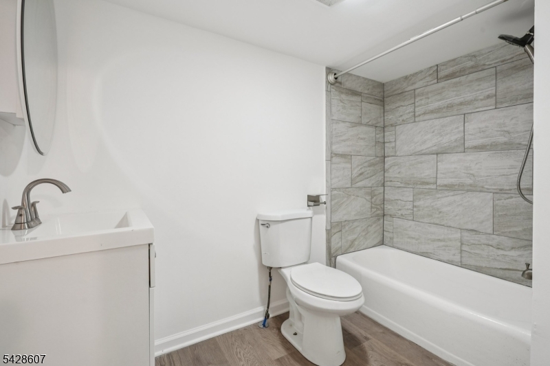 223 Waconia Road Vernon, NJ 07422 - Photo 21 of 26 a bathroom with a toilet a sink and bathtub