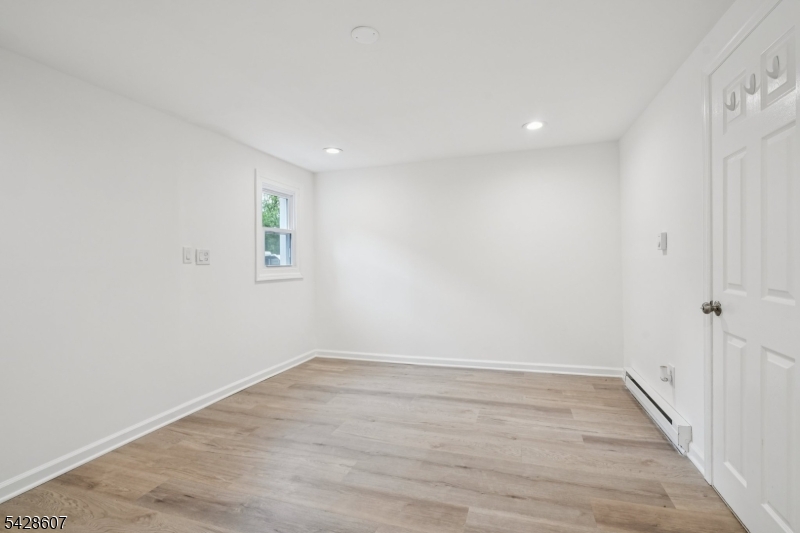 223 Waconia Road Vernon, NJ 07422 - Photo 22 of 26 wooden floor in an empty room with a window