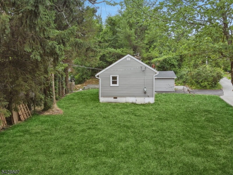 223 Waconia Road Vernon, NJ 07422 - Photo 3 of 26 a view of a backyard with barn and large trees