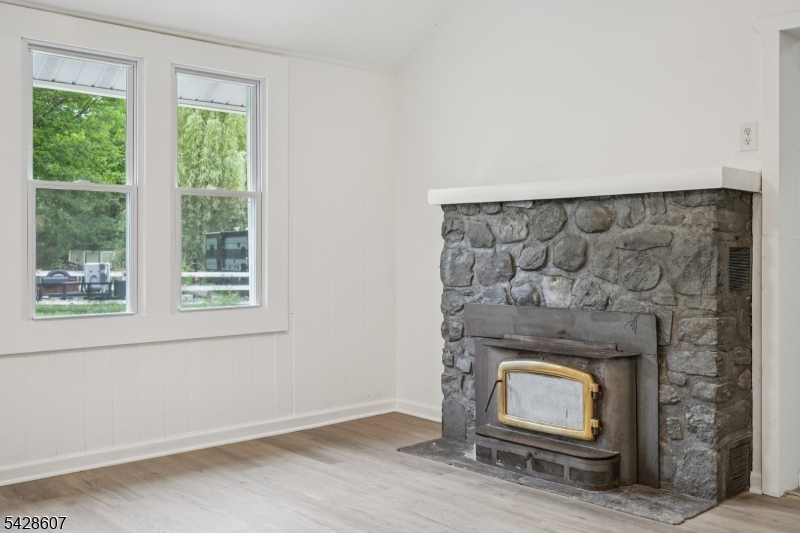 223 Waconia Road Vernon, NJ 07422 - Photo 7 of 26 a living room with a fireplace in it
