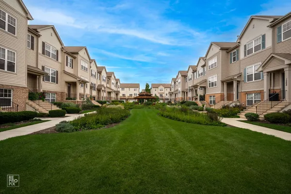 a view of a big yard and front view of a building