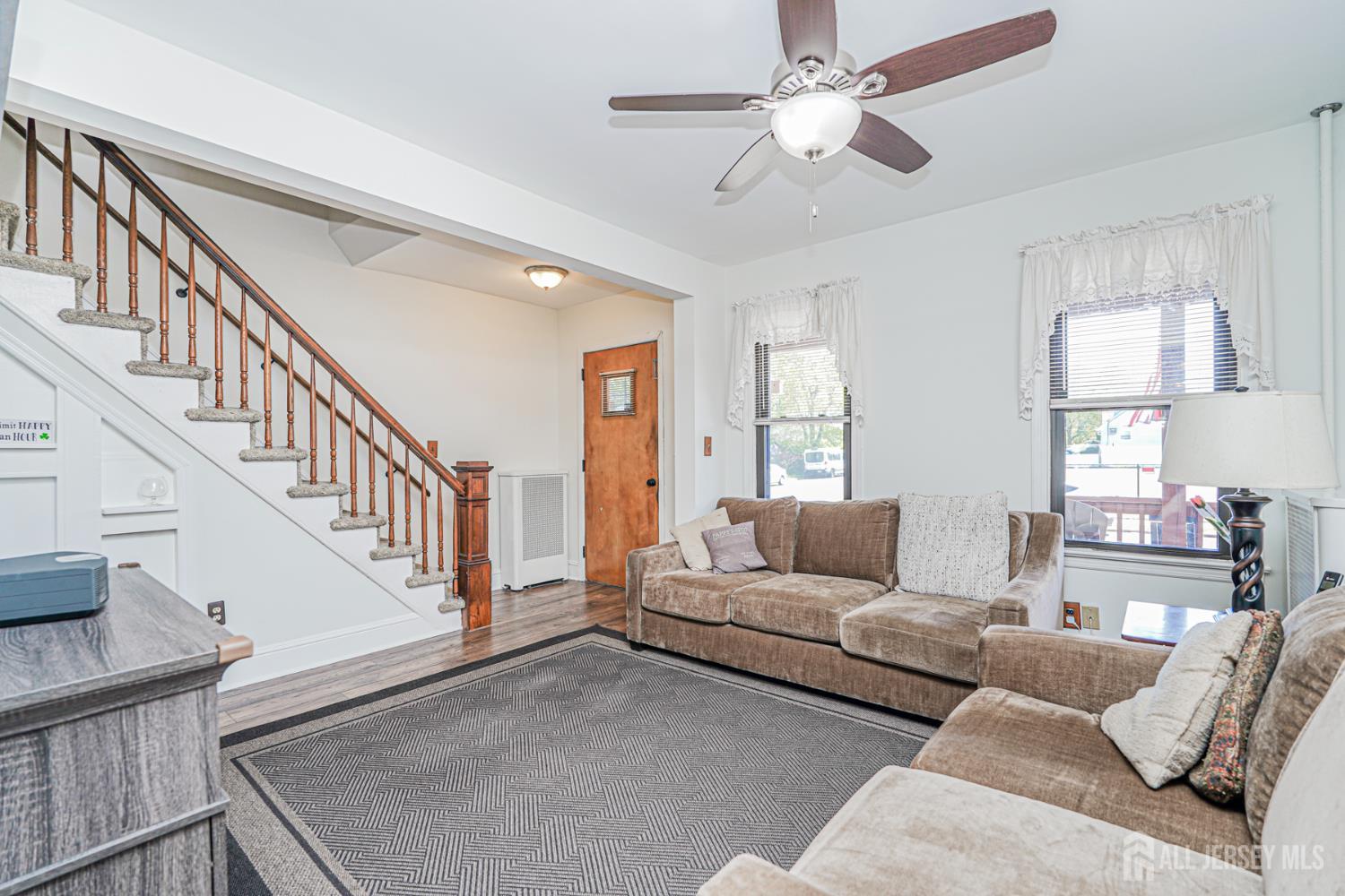 12 Fox Road Edison, NJ 08817 - Photo 4 of 21 a living room with furniture and a chandelier
