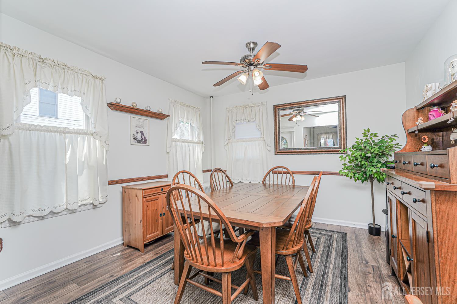 12 Fox Road Edison, NJ 08817 - Photo 5 of 21 a view of a dining room with furniture and a potted plant