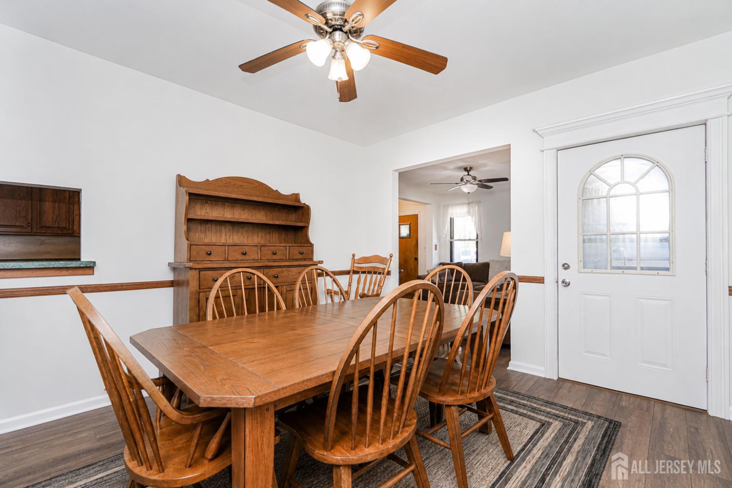 12 Fox Road Edison, NJ 08817 - Photo 6 of 21 a dining room with furniture a chandelier and wooden floor