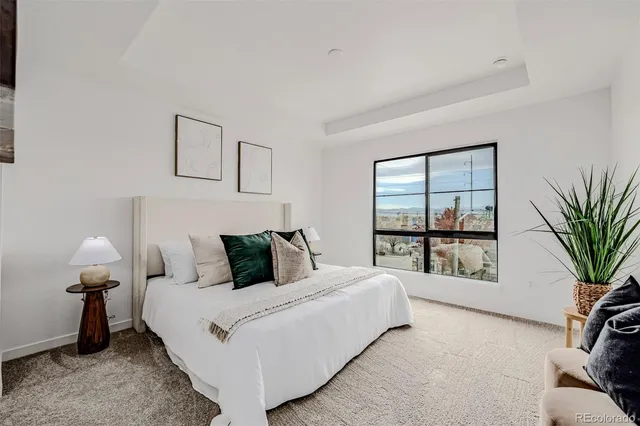 a bathroom with a granite countertop sink a shower and a mirror