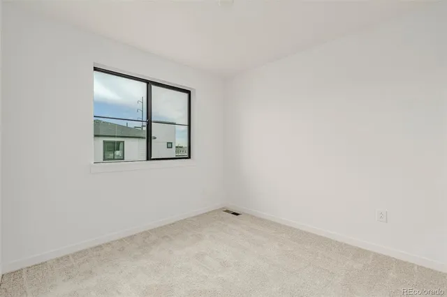 a bedroom with a bed and a table