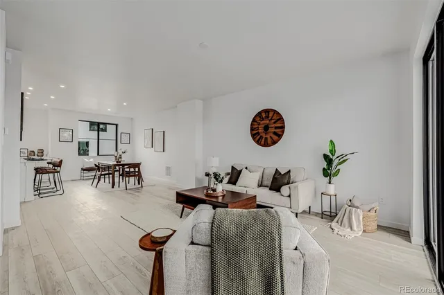 a living room with furniture and a table
