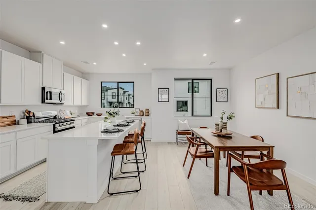 a kitchen with a table and chairs in it