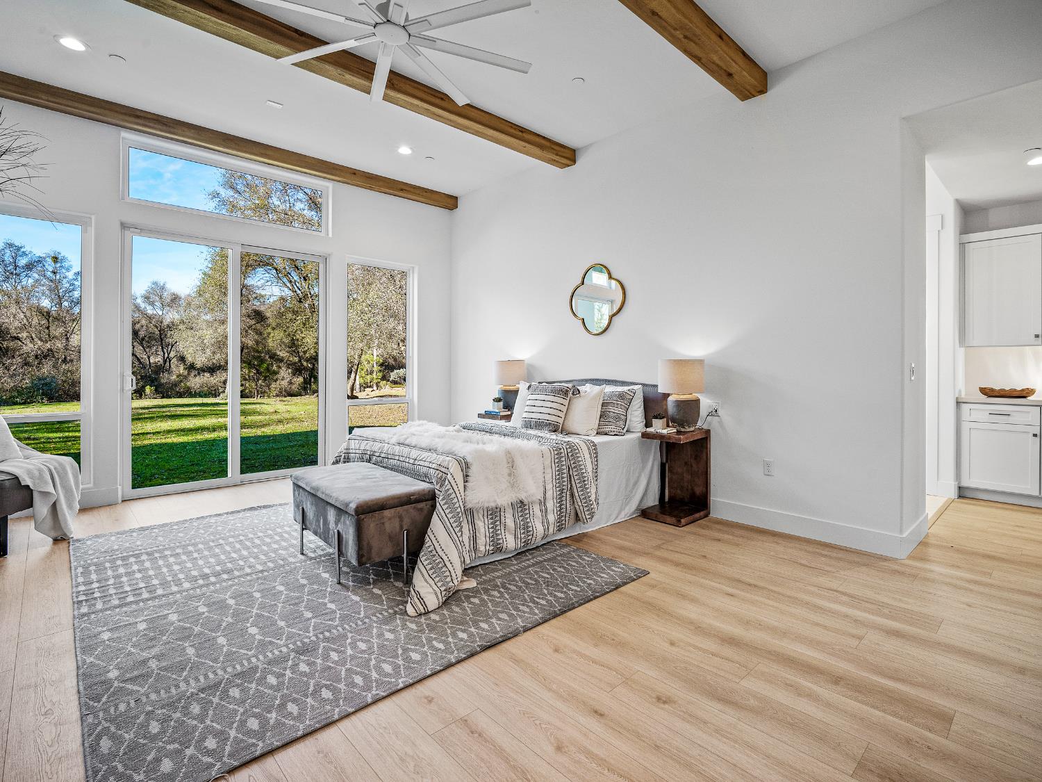 8118 Bridger Lane Shingle Springs, CA 95682 - Photo 15 of 59 a spacious bedroom with a bed a large window with outer view and balcony view