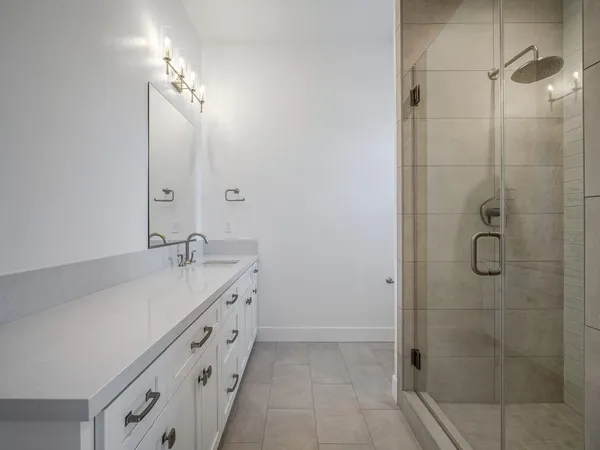 a bedroom with a bed and a television