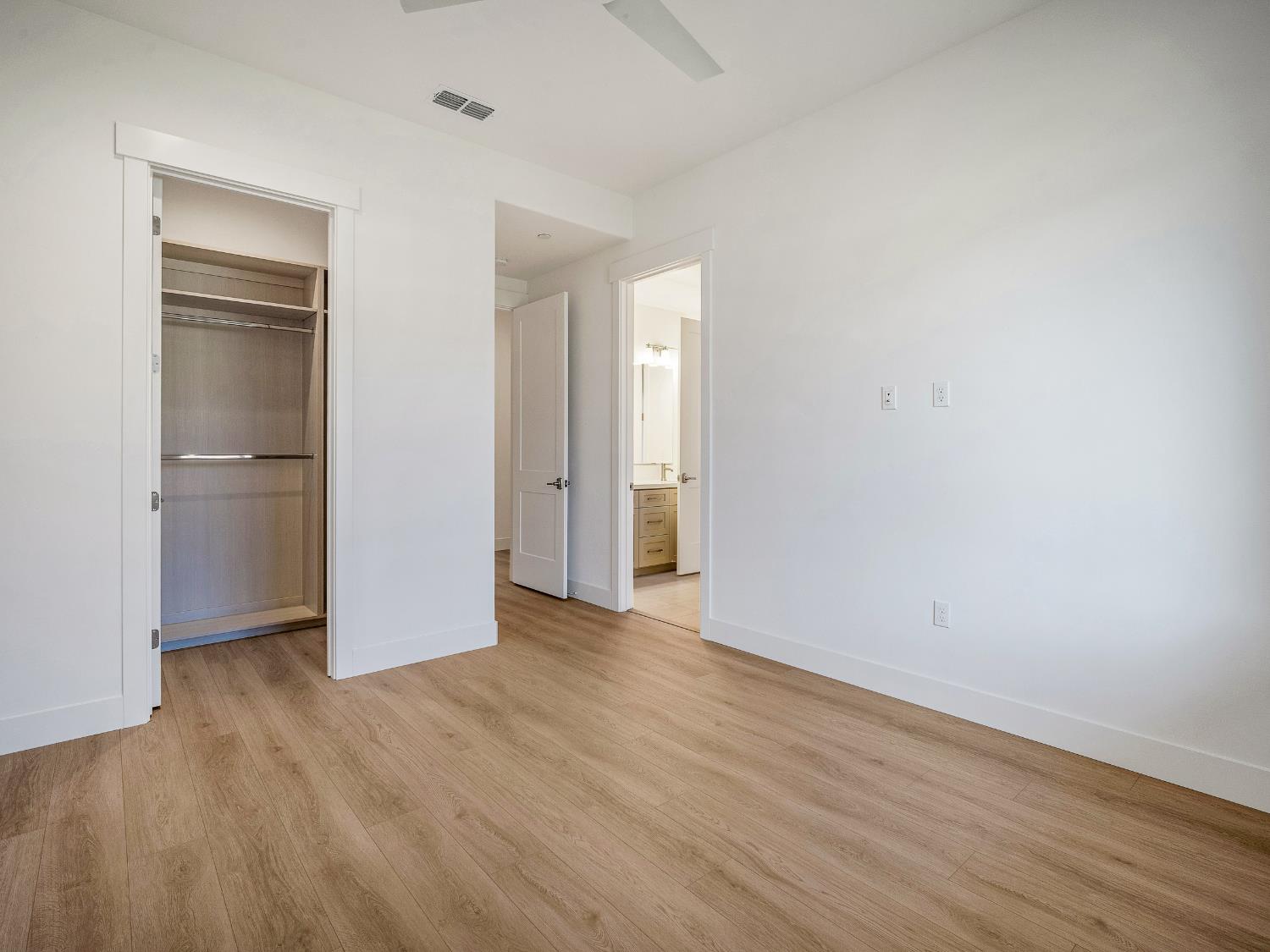 8118 Bridger Lane Shingle Springs, CA 95682 - Photo 28 of 59 a view of an empty room with wooden floor and closet