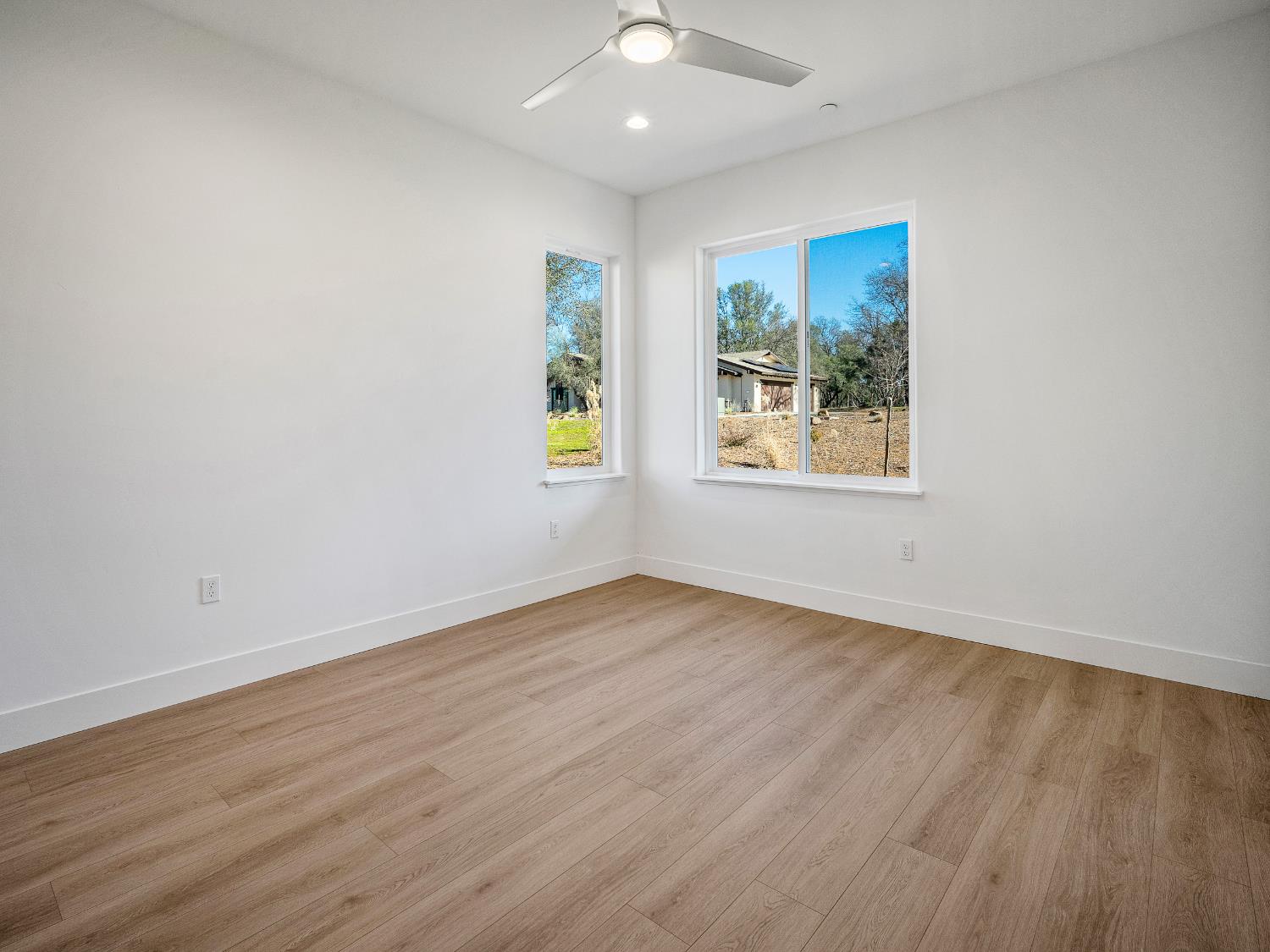 8118 Bridger Lane Shingle Springs, CA 95682 - Photo 29 of 59 wooden floor in an empty room with a window