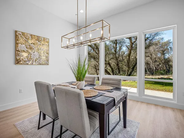 a view of a room with gym equipment and windows