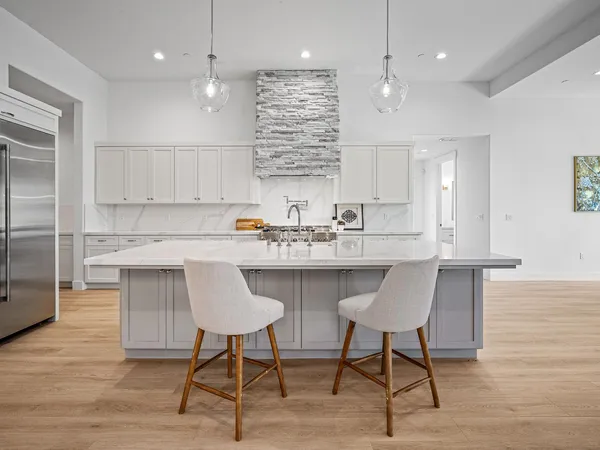 a kitchen with cabinets appliances and a counter top