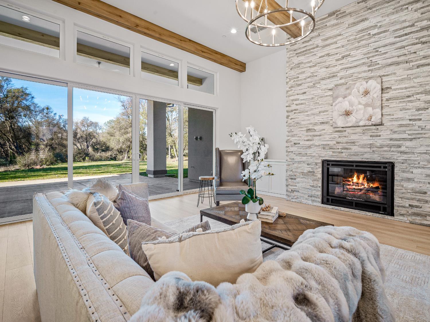 8118 Bridger Lane Shingle Springs, CA 95682 - Photo 8 of 59 a living room with furniture and a fireplace